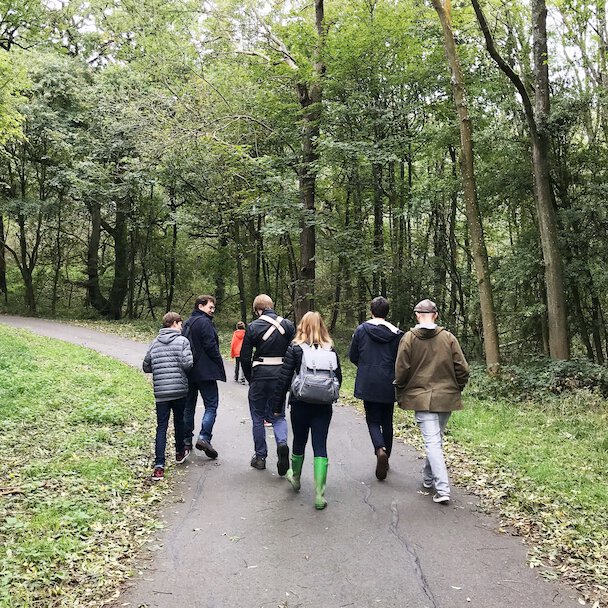 Bookwhen team walking in the woods.