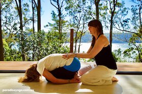 Clare with student at Paradise Yoga.