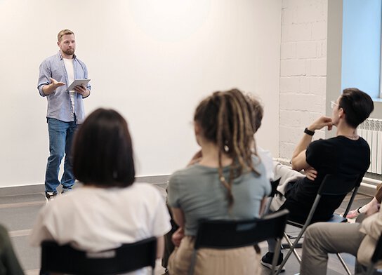 Man presenting at training course.